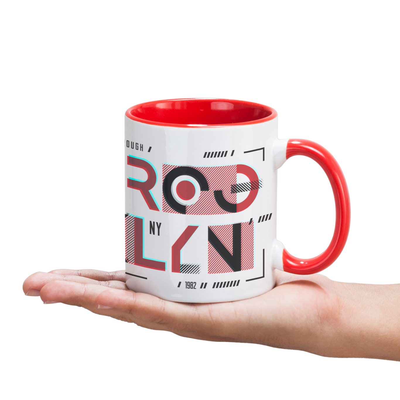 Taza MANGO Taza con diseño gráfico en blanco y rojo, sostenida en una mano.